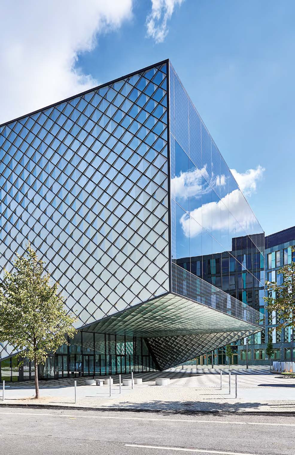Glazed façade with a deep cantilevered entrance canopy